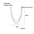 Minimalist silver flexible leather belt wall lamp bedroom light