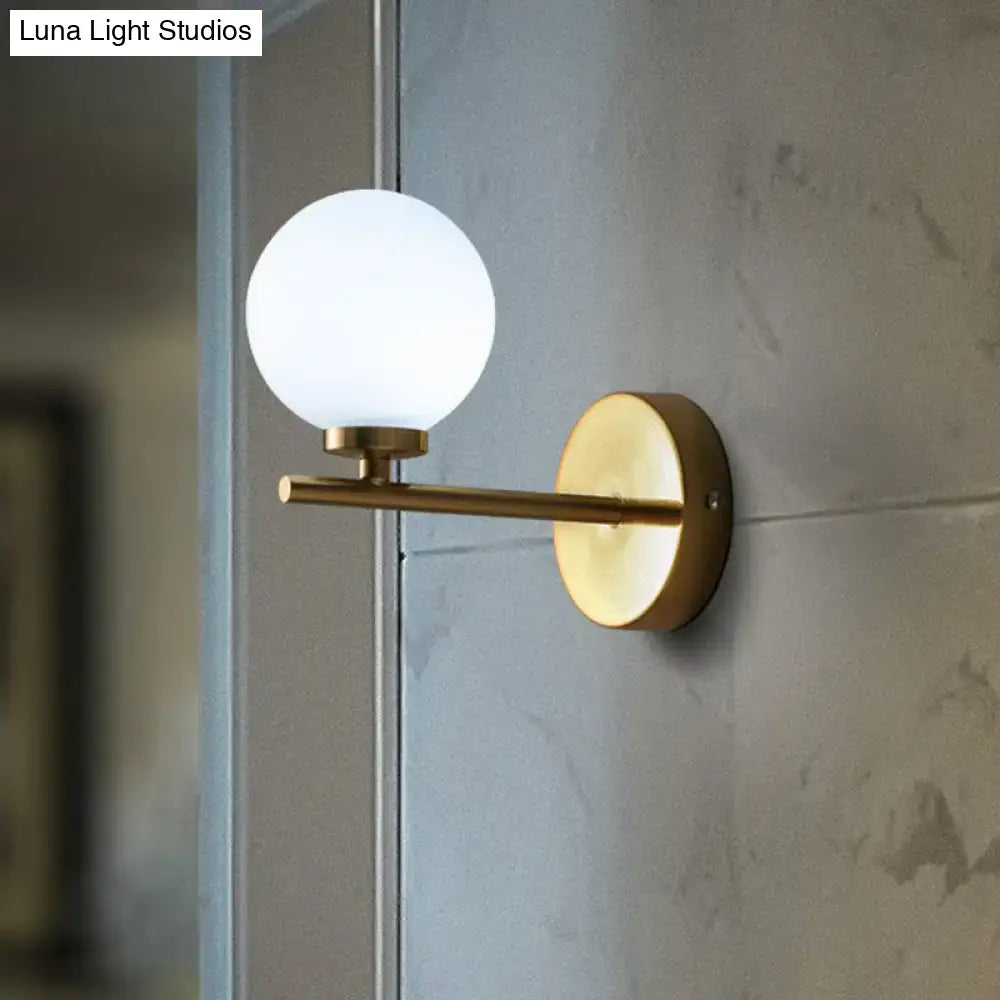 Elegant gold and ivory glass wall sconce for bedroom light