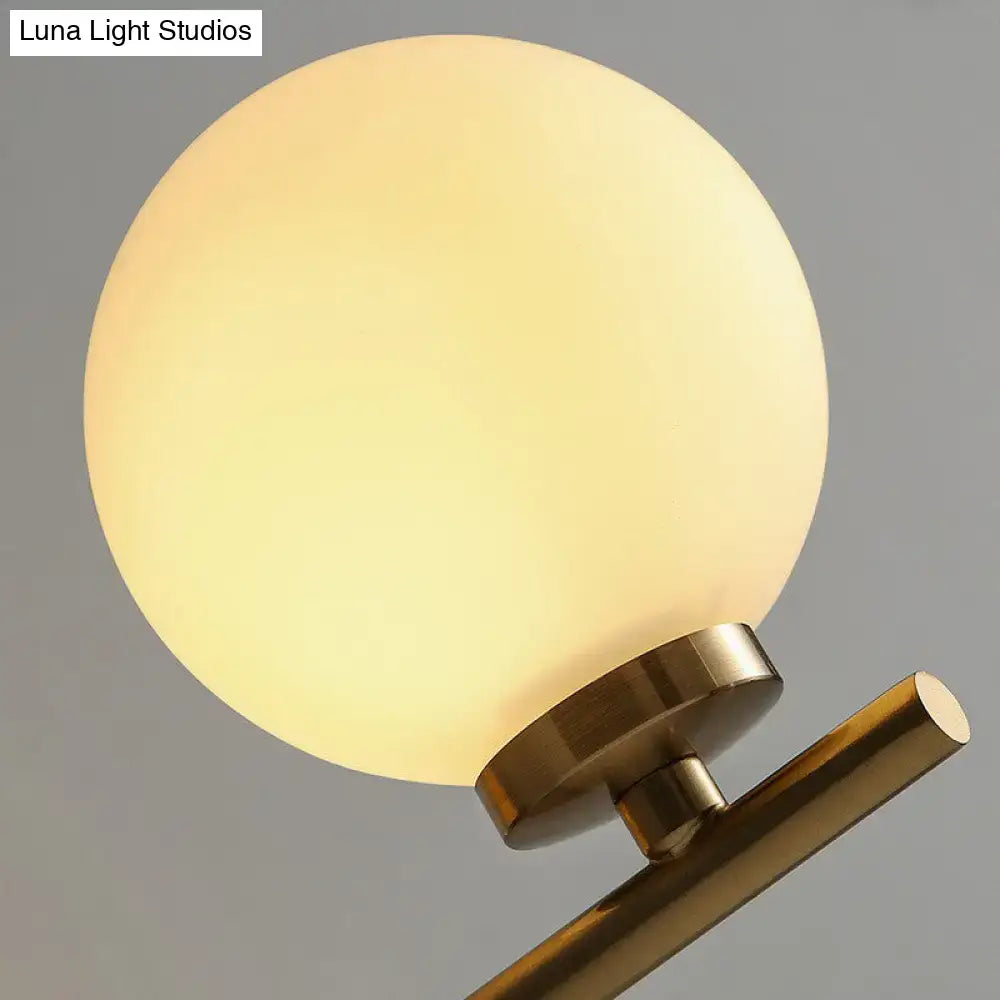 Elegant gold and ivory glass wall sconce for bedroom light