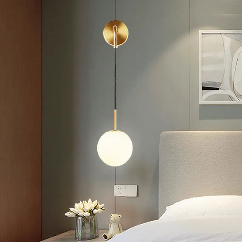 Gold opal glass spherical wall light fixture for bedroom