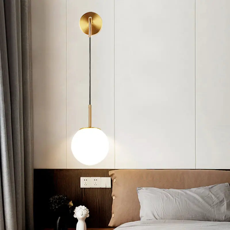 Gold opal glass spherical wall light fixture for bedroom