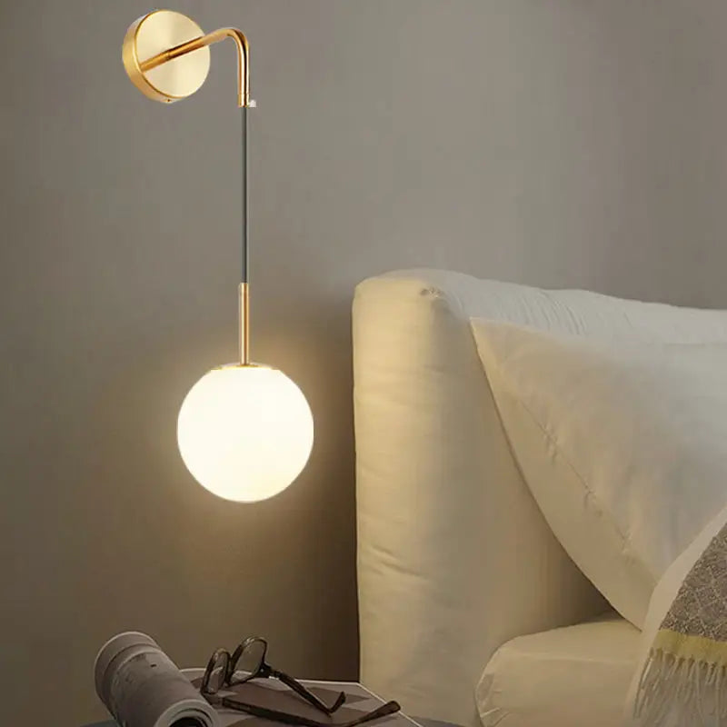 Gold opal glass spherical wall light fixture for bedroom