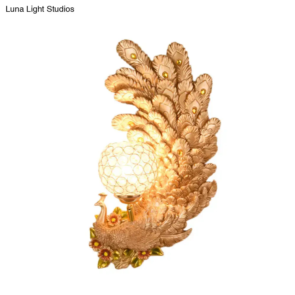 Golden peacock wall light with crystal shade – living room yellow & green