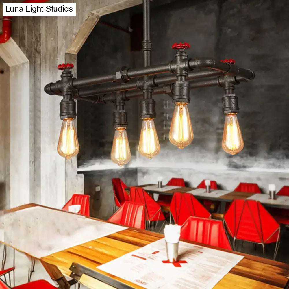 Industrial black pipe hanging ceiling light – dining room red accents