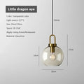 Industrial smoked glass and brass pendant light – dining room