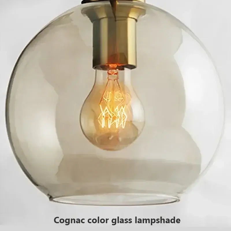 Industrial smoked glass and brass pendant light – dining room