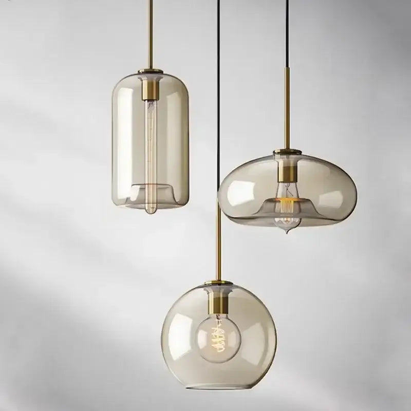 Industrial smoked glass and brass pendant light – dining room