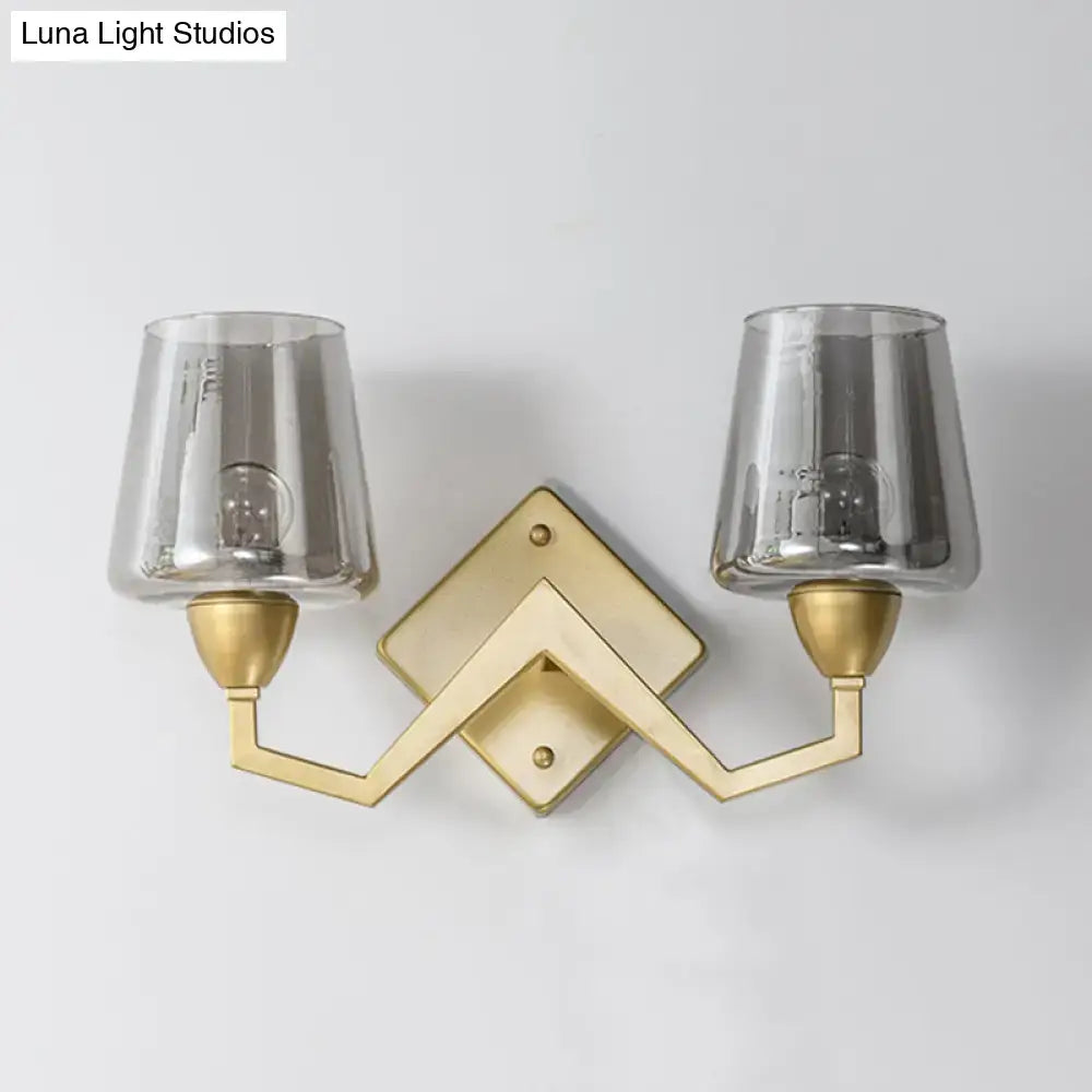 Mid-century brass wall lamp with truncated cone shade for bedroom