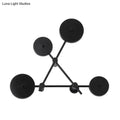 Minimalist black geometric wall light fixture for living room