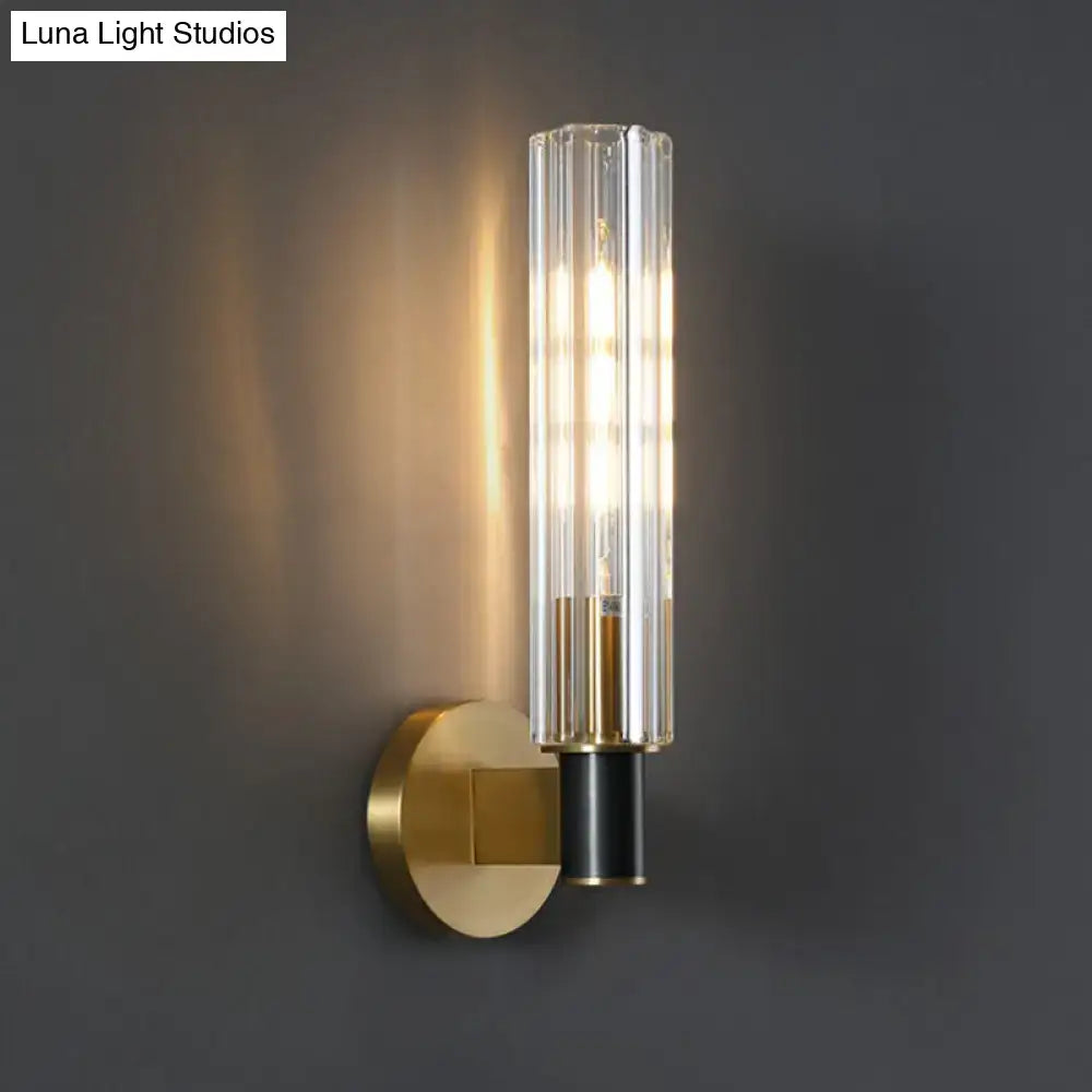 Minimalist brass finish tubular wall light sconce for bedroom