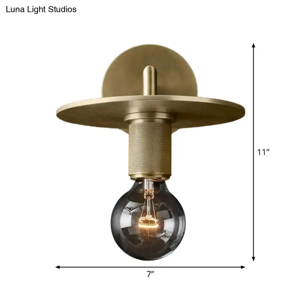 Minimalist bronze wall sconce with glass shade bedroom light