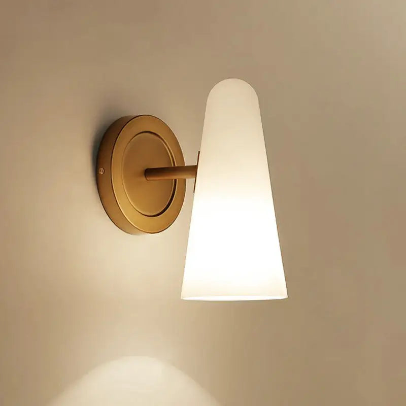 Minimalist gold wall sconce light with frosted glass shade living room