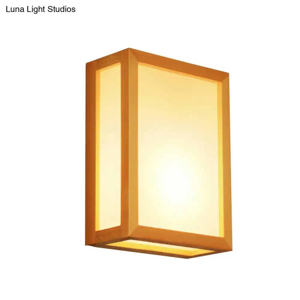 Minimalist white glass wall sconce with wooden frame for corridors