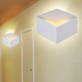 Minimalist white metallic geometric wall mount light for corridor