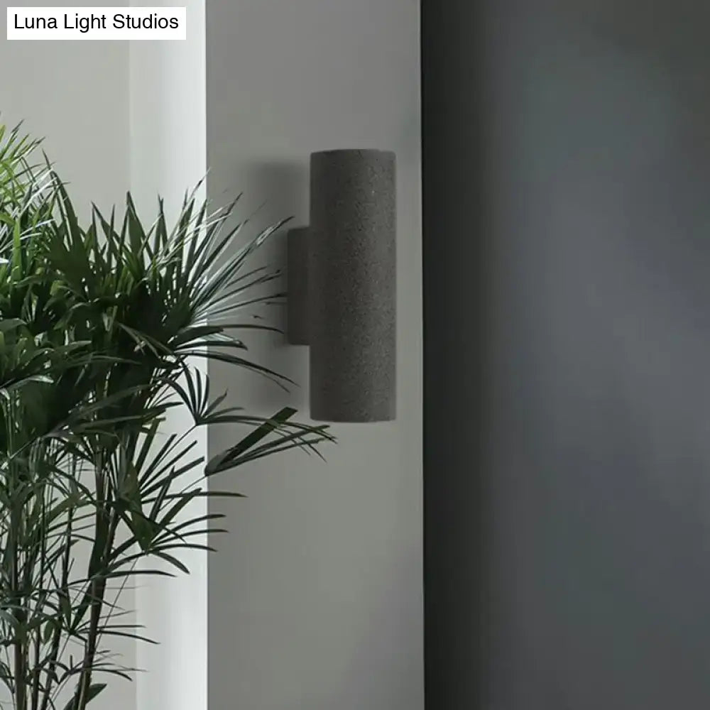 Minimalist white terrazzo stair wall sconce with compact fixture height