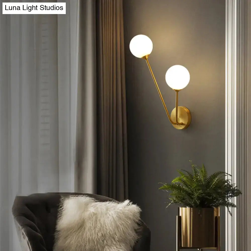 Minimalistic brass branch wall light with frosted glass for bedroom