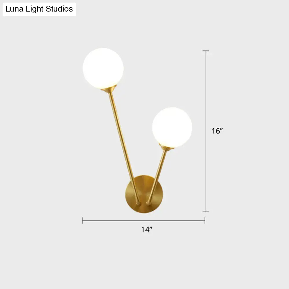 Minimalistic brass branch wall light with frosted glass for bedroom