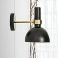 Modern black and brass domed wall lamp for bedroom bedside