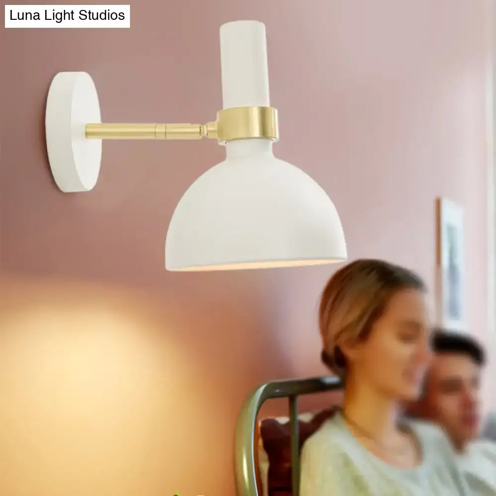 Modern black and brass domed wall lamp for bedroom bedside