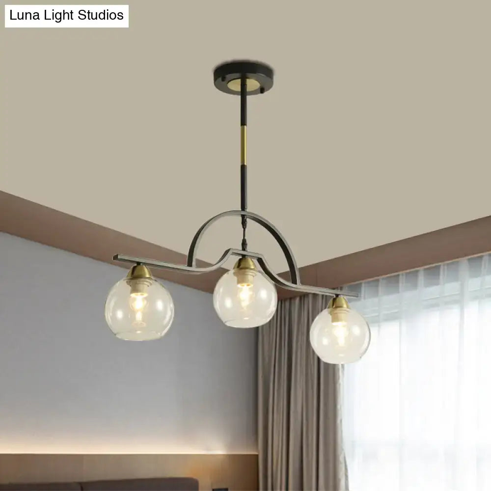 Modern black and brass pendant light with clear glass – kitchen island