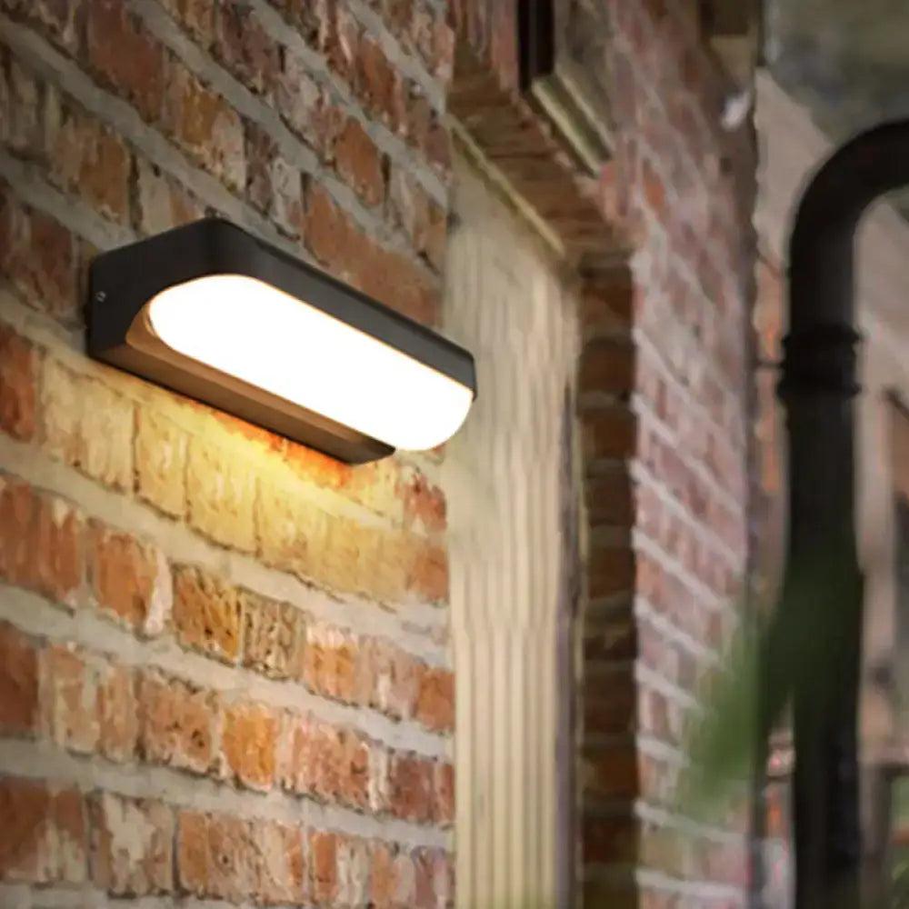 DecorBites™ Modern Black Acrylic Wall Sconce with Flush Capsule Design and Half-Bulb Mounting