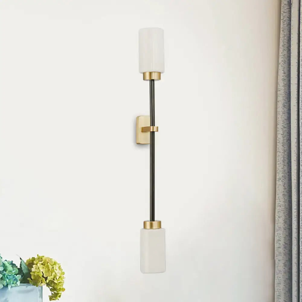 Modern black & gold wall sconce with white glass shade living room