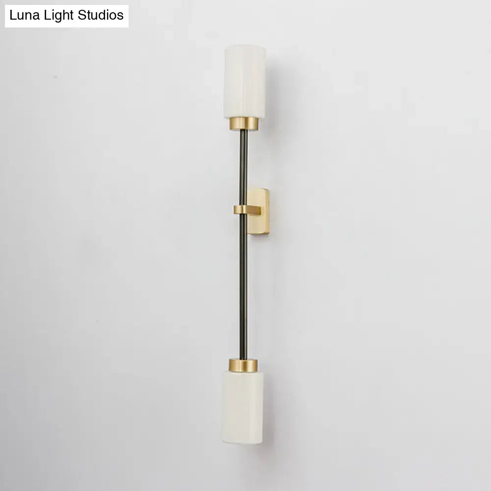 Modern black & gold wall sconce with white glass shade living room