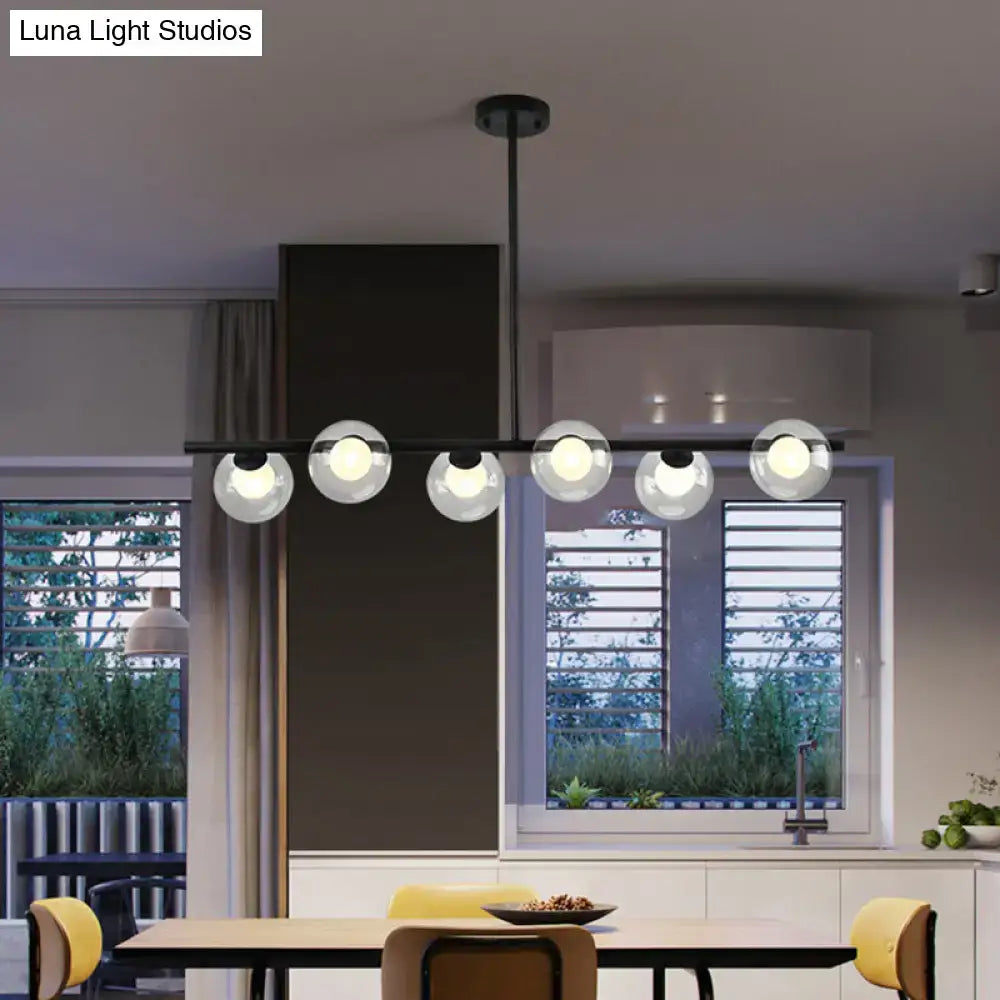 Modern black island pendant with clear glass globes dining room