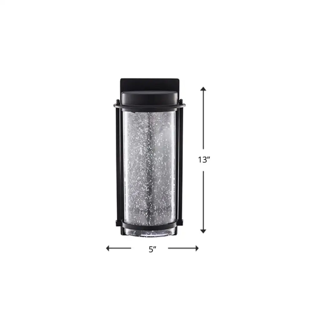 Modern black led outdoor wall sconce with rippled glass cylinder