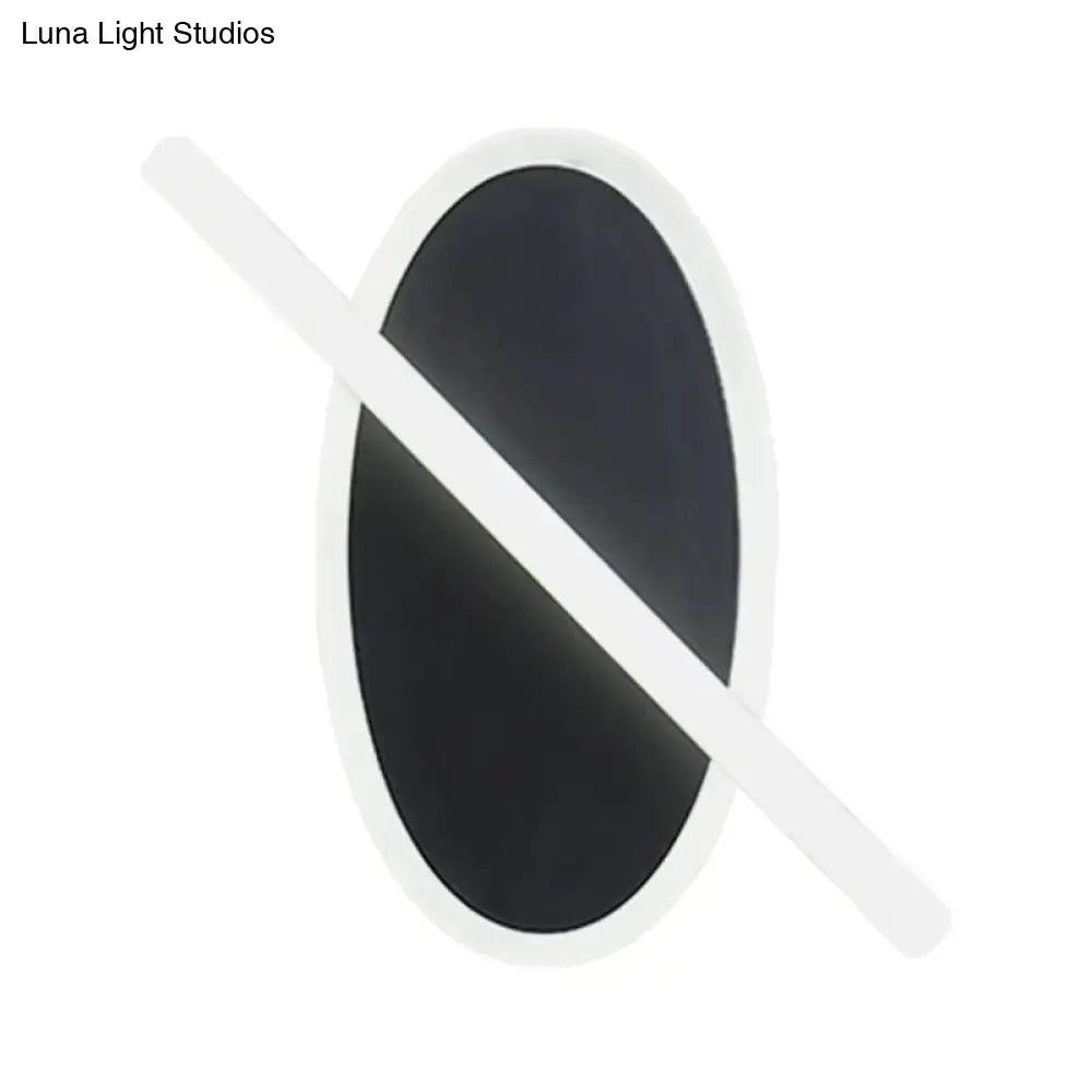 Modern black & white oval led sconce stairway light with warm glow