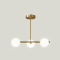 Modern brass 5-light pendant light with spherical glass shade dining room
