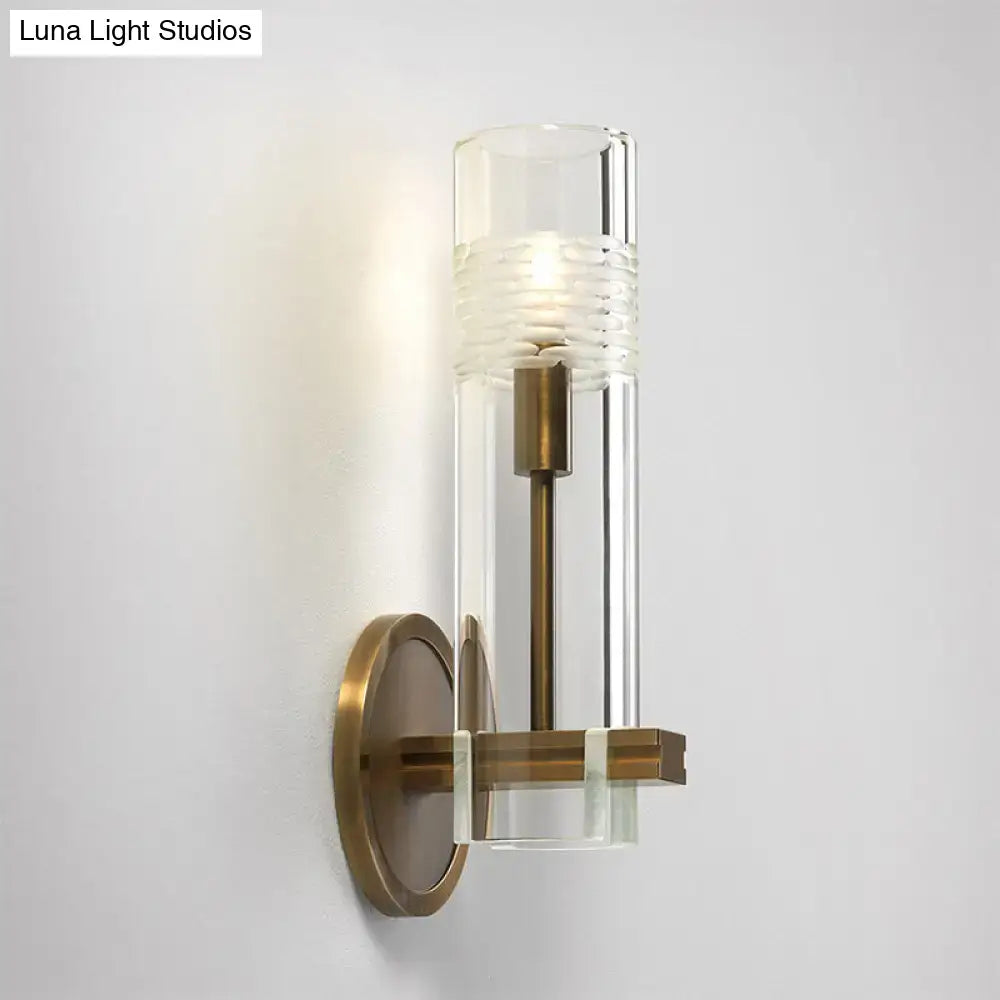 Modern brass and clear glass metal arm sconce bedroom wall light
