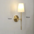 Modern brass and cream fabric led wall lamps for bedroom