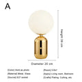 Modern brass and glass desk lamp for bedroom with spherical shade