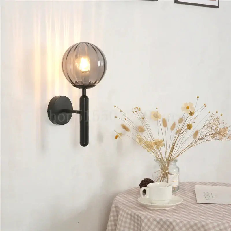Modern brass and pink glass wall lamp for living room