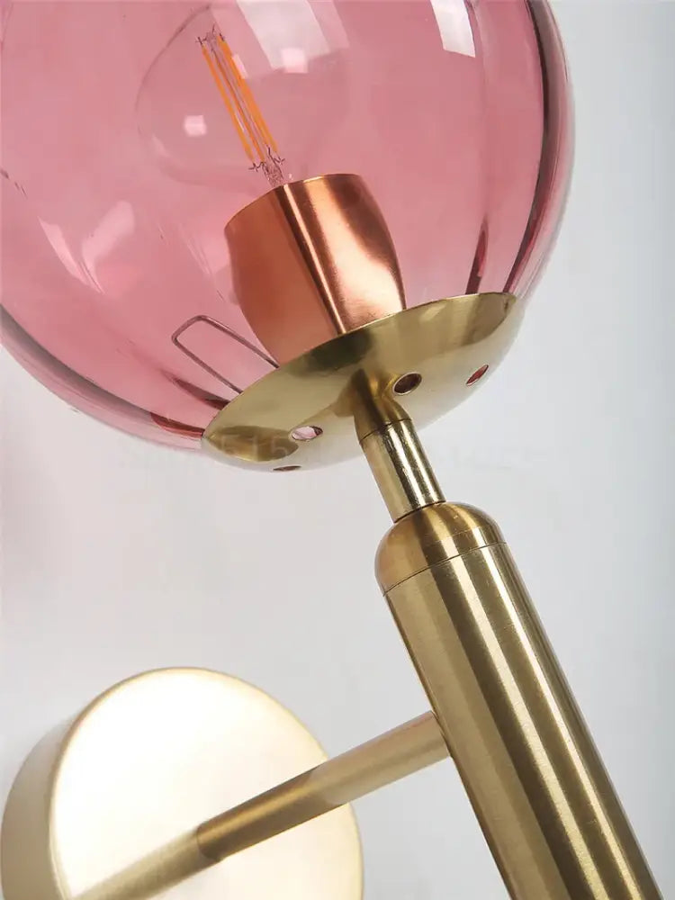 Modern brass and pink glass wall lamp for living room