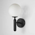 Modern brass and pink glass wall sconce for bedroom