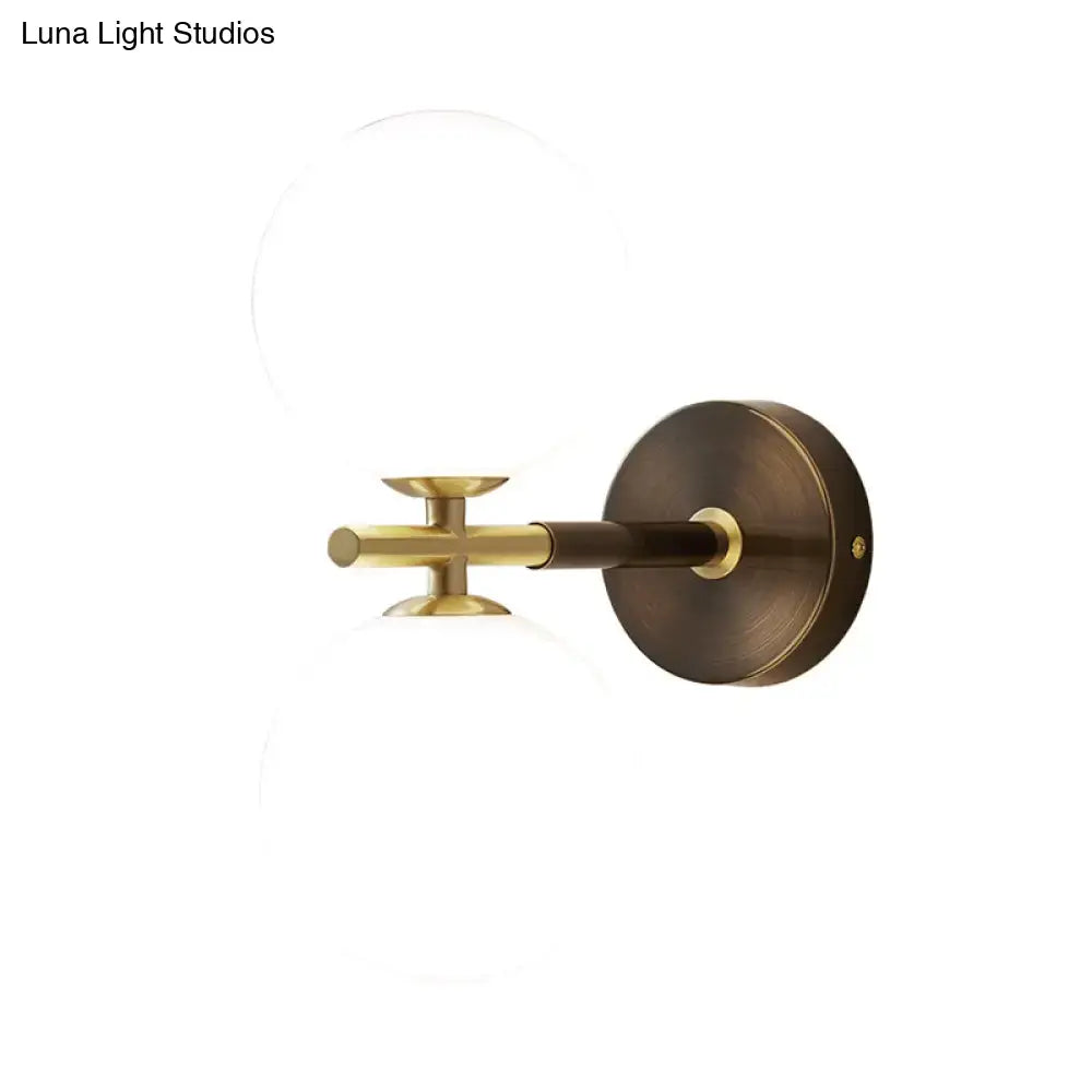 Modern brass and white glass wall sconce – bedroom globe light