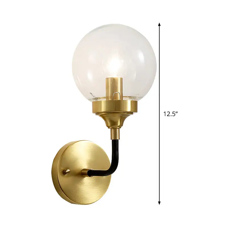 Modern brass curved arm wall sconce with clear glass for bedroom