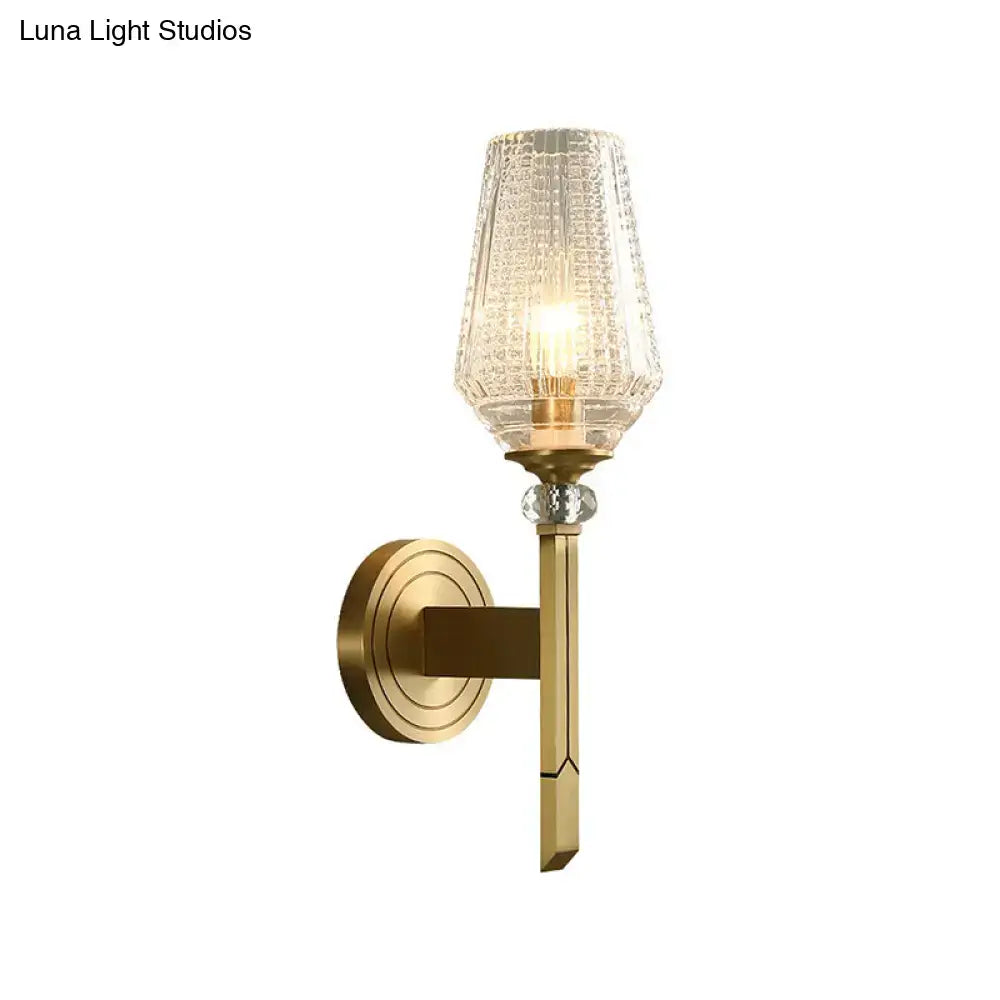 Modern brass diamond wall light with lattice glass shade bedroom
