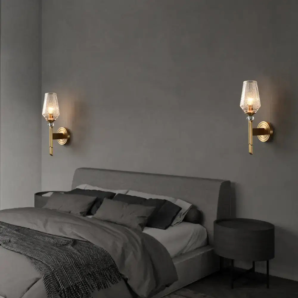 Modern brass diamond wall light with lattice glass shade bedroom
