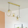 Modern brass global island lamp with white bird dining room light