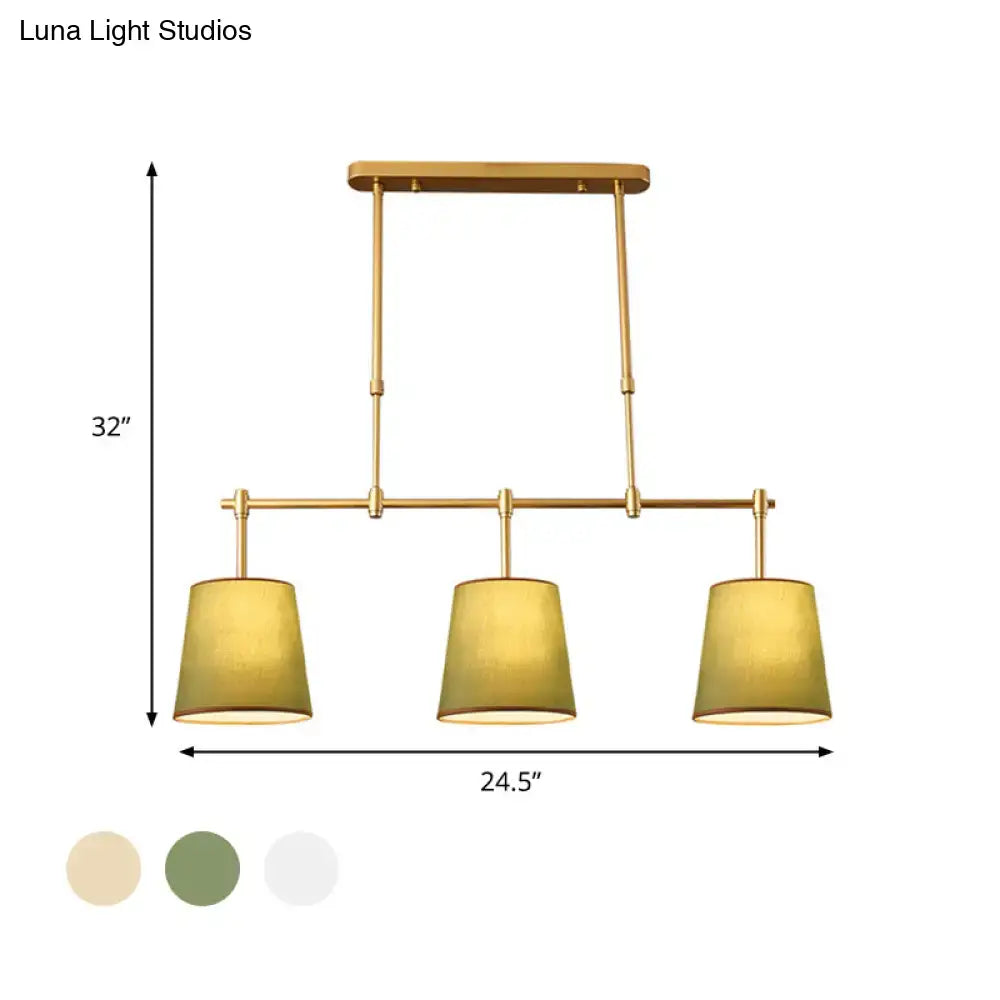 Modern brass pendant light with white green flaxen shades dining room