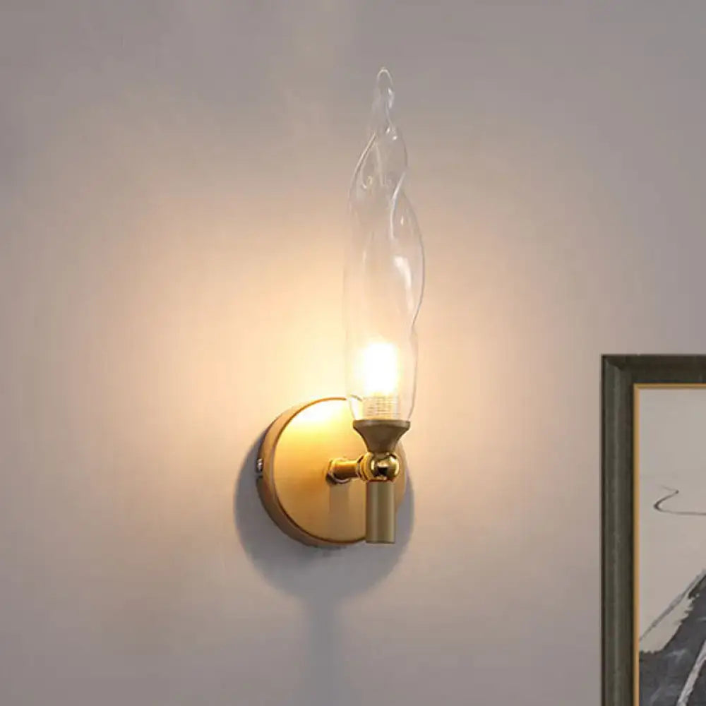 Modern brass torch sconce with clear glass bedroom wall lamp