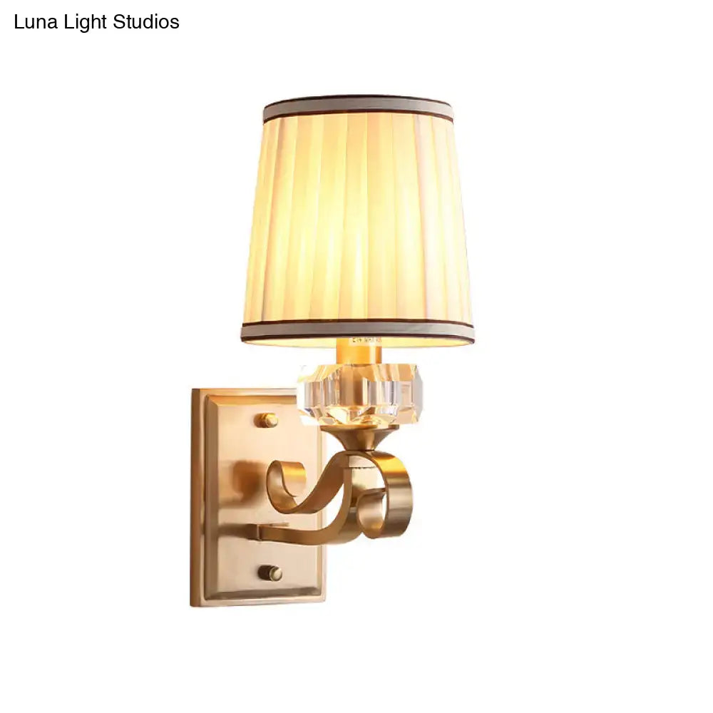 Modern brass wall lamp – bedroom sconce with pleated shade