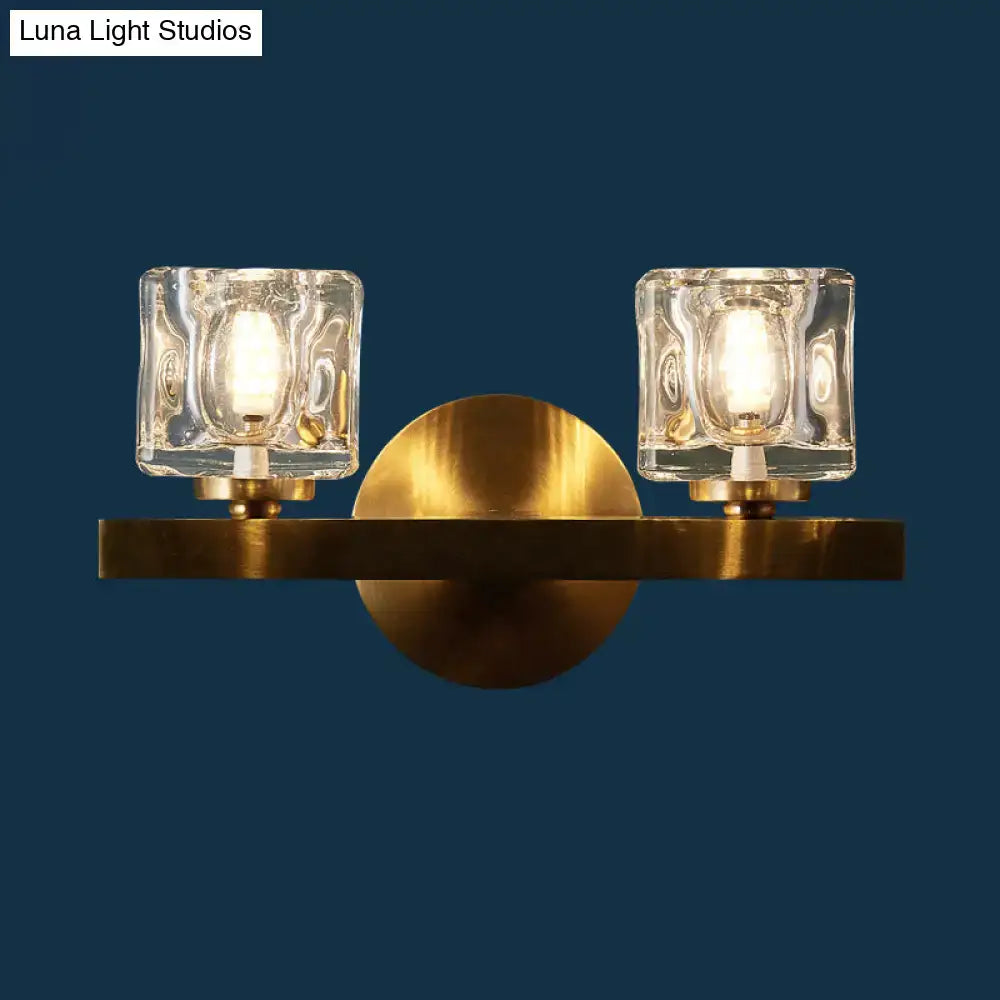 Modern brass wall light with clear crystal block for living room