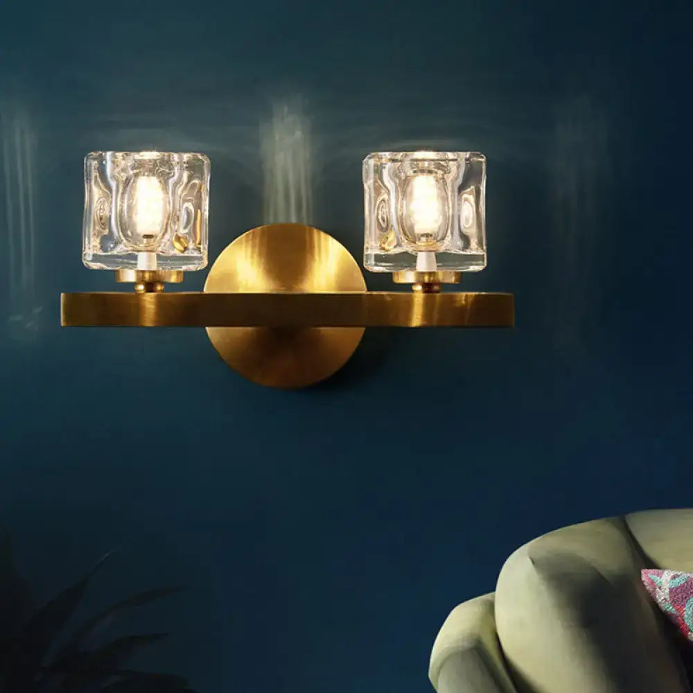 Modern brass wall light with clear crystal block for living room