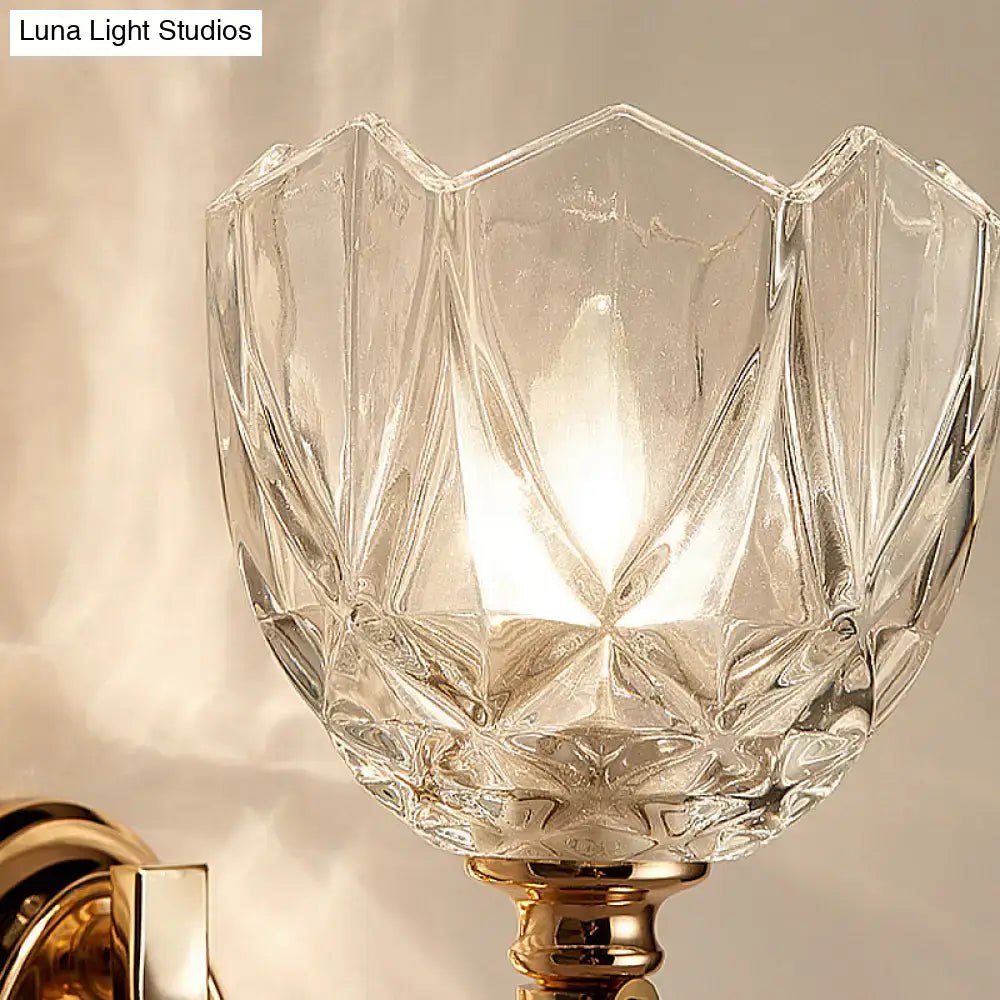 Modern brass wall sconce bedroom light with faceted clear glass shade