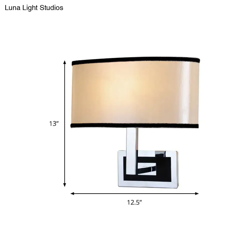 Modern chrome and beige oval wall sconce bedroom light