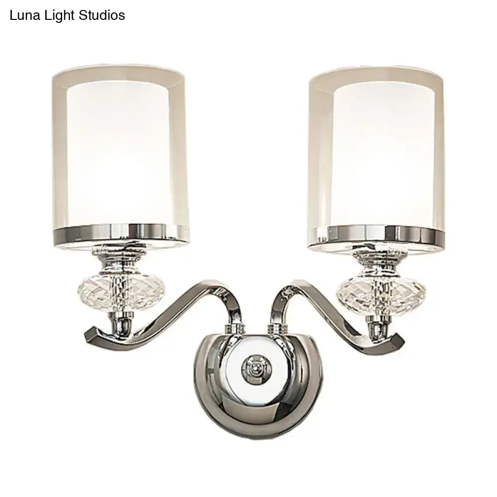 Modern chrome dual cylinder bathroom sconce with curvy arm